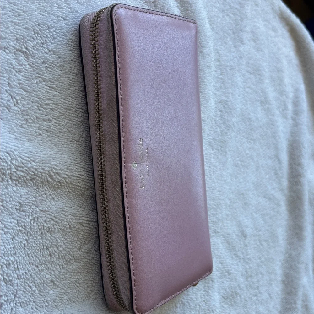 kate spade Leather Zip-Around Wallet in Mauve Pink with Gold Logo